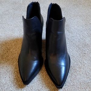 Black Vince Camuto leather boots.